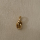 SINUOSA add-on in 18k recycled gold, handcrafted in Basel, Switzerland with an organic twisted design.