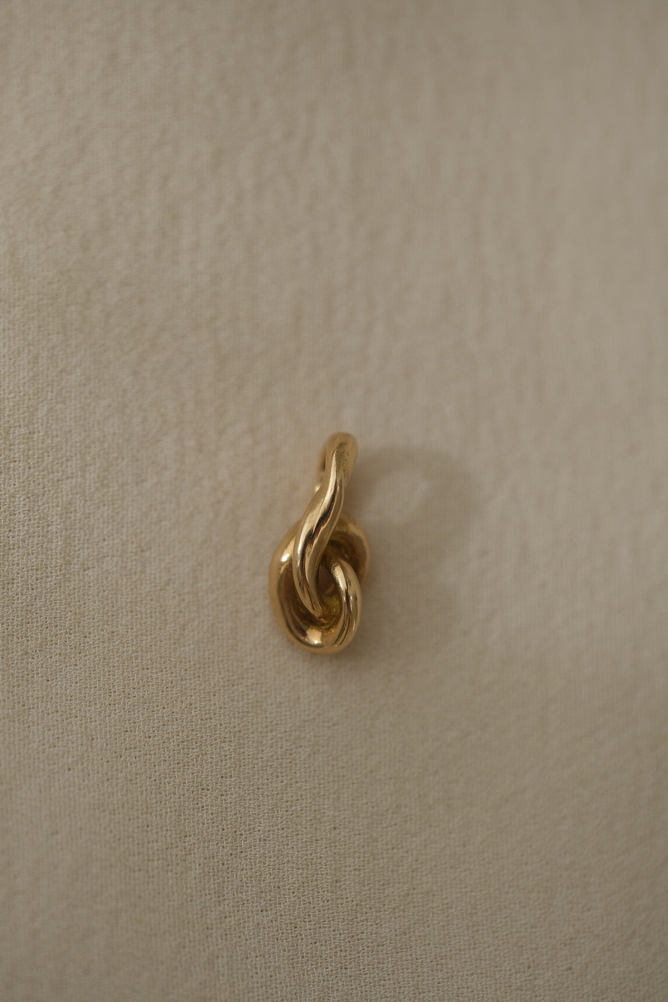 SINUOSA add-on in 18k recycled gold, handcrafted in Basel, Switzerland with an organic twisted design.