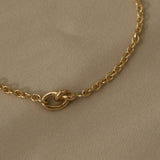 Close-up of a handcrafted 18k recycled gold bracelet with a natural shiny surface, designed and polished in Basel Switzerland.