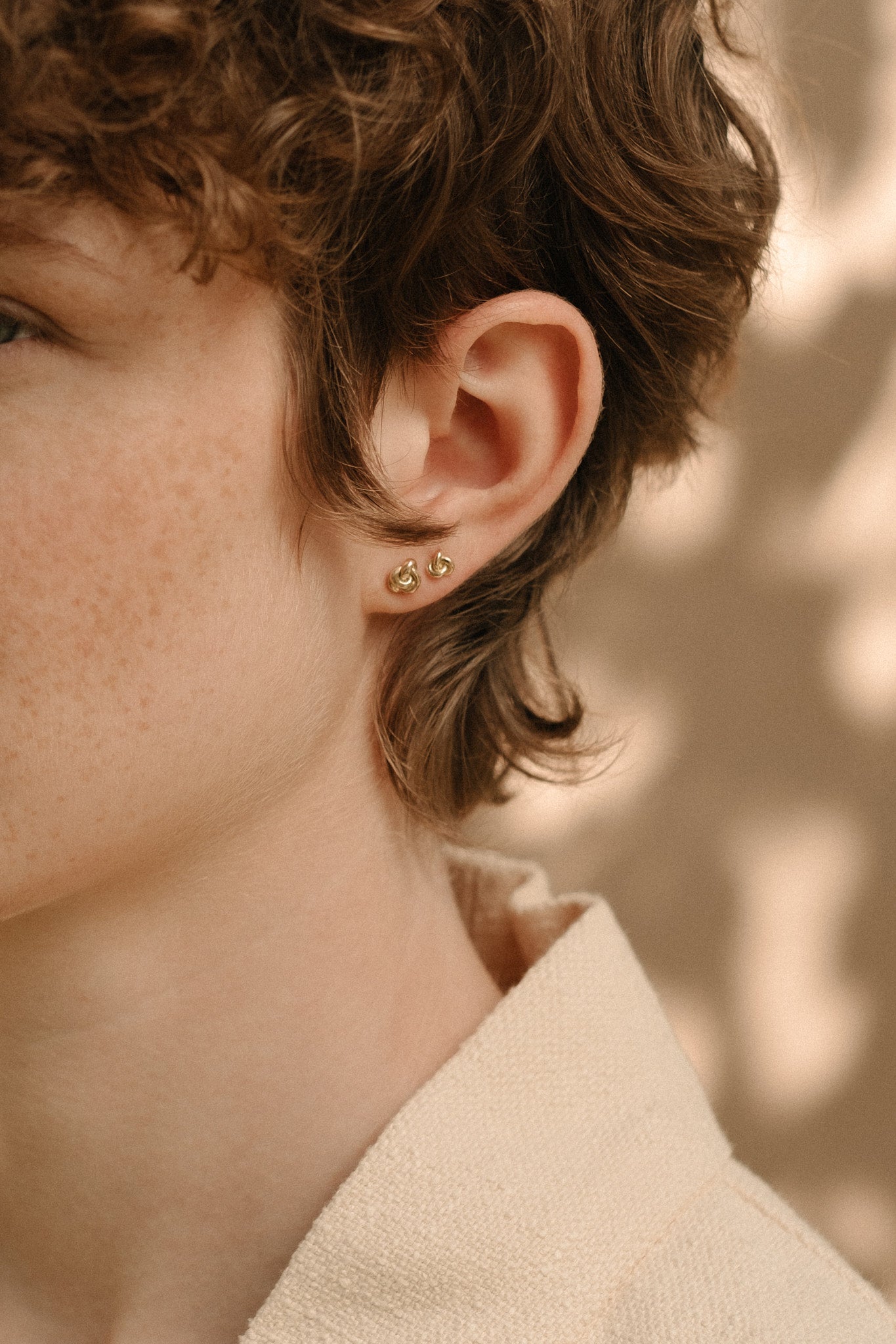 TOVE big studs 18k gold earrings, handcrafted in Basel, Switzerland from 100% recycled gold, featuring an organic design.