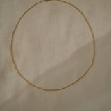 Handcrafted 18k recycled gold anchor chain from Basel, Switzerland, featuring faceted links and organic design.