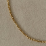 Braided TRESSE Chain made from 18k recycled gold, handcrafted in Basel, Switzerland. Elegant and organic design.