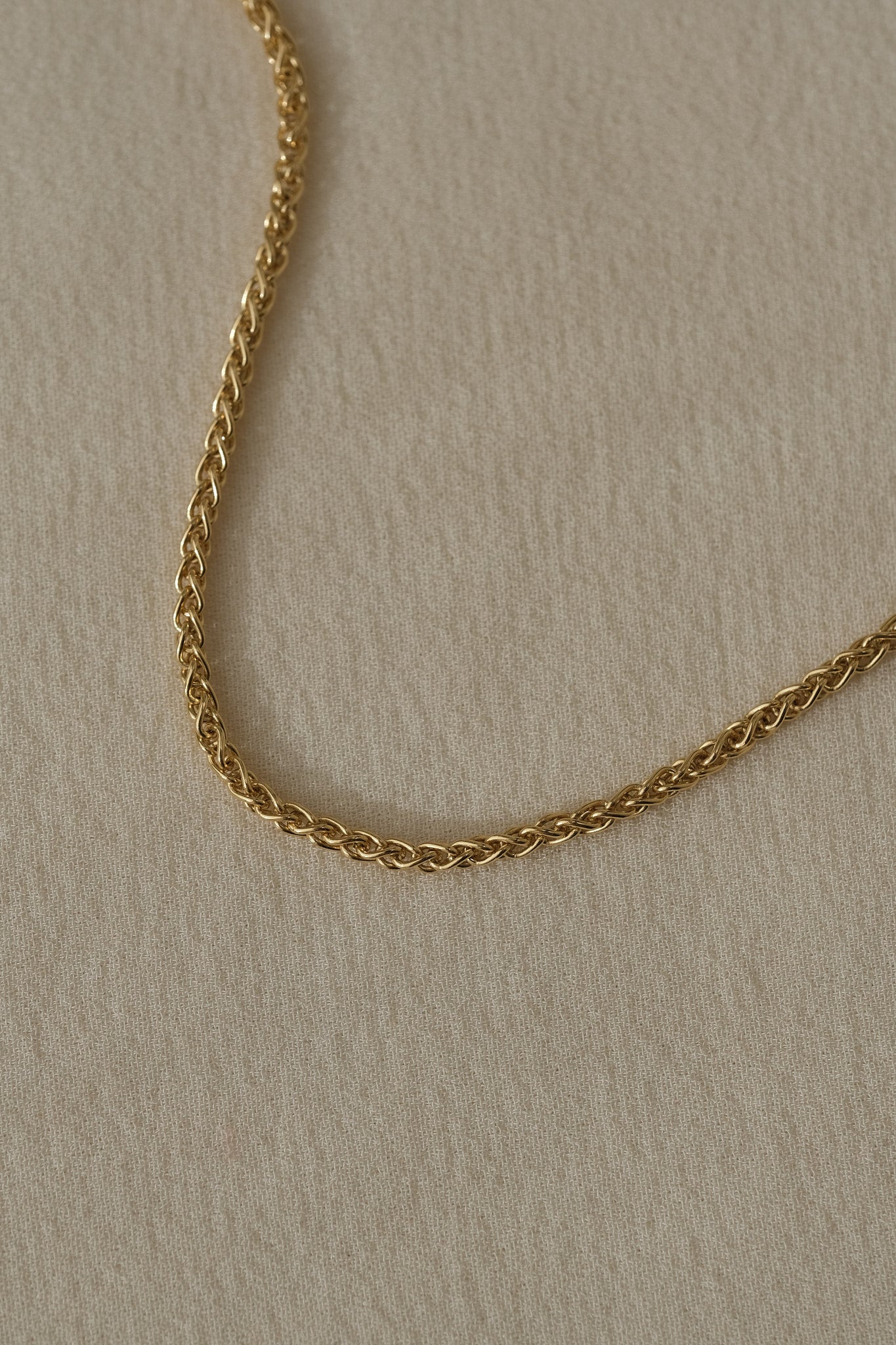Handcrafted TRESSE chain in 18k recycled gold, designed in Basel, Switzerland, showcasing sustainable elegance.
