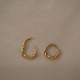 AGAPI hoops in 18k recycled gold. Sustainable jewelry designed and crafted in Basel, Switzerland.