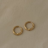 AGAPI hoops in 18k recycled gold, sustainable earrings designed and polished in Basel, Switzerland.