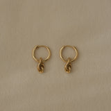 SINUOSA hoops in 18k recycled gold, handcrafted in Basel, highlighting organic design and natural shine.
