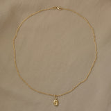TWINE necklace in 18k recycled gold, handcrafted in Basel, featuring a delicate chain and organic pendant design.