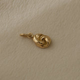 Handcrafted TWINE pendant in 18k recycled gold, organic design, made in Basel, Switzerland.