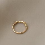 Handcrafted AGAPI ring in 18k recycled gold, featuring a natural shiny surface, designed in Basel, Switzerland.