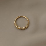 Handcrafted AGAPI ring in 18k recycled gold, featuring a natural shiny surface, made in Basel, Switzerland.