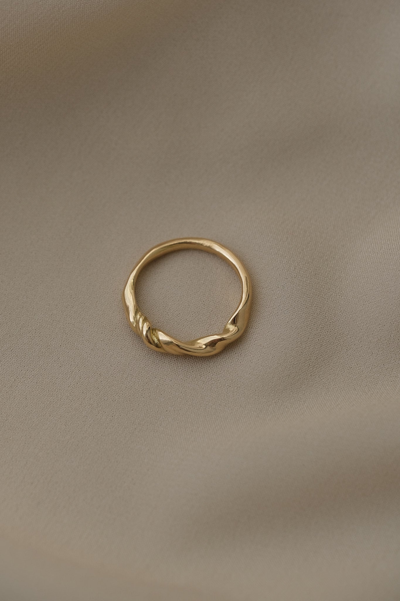 Handcrafted AGAPI ring in 18k recycled gold, featuring a natural shiny surface, made in Basel, Switzerland.