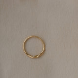 Handcrafted NYSSA ring in 18k recycled gold, featuring a natural shiny surface, designed in Basel, Switzerland.