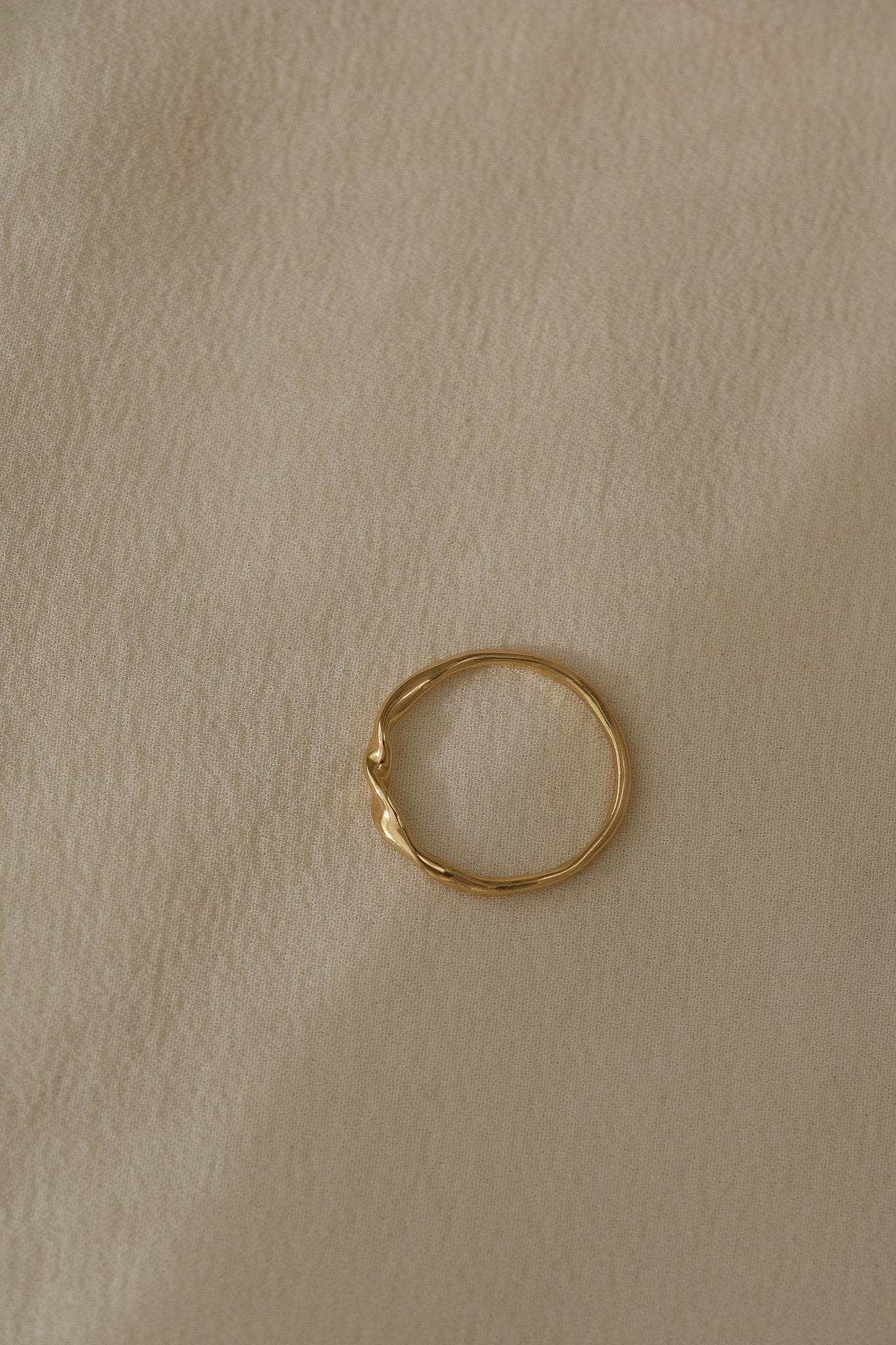 Handcrafted NYSSA ring in 18k recycled gold from Basel, Switzerland, featuring an organic, shiny surface.