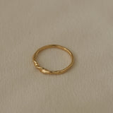 Handcrafted NYSSA ring in 18k recycled gold, designed in Basel Switzerland, showcasing an organic shiny surface.