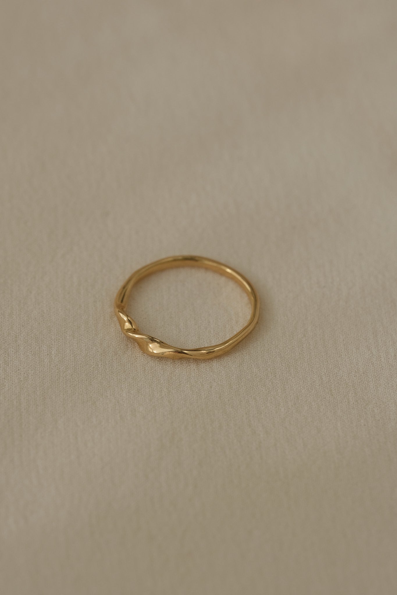 Handcrafted NYSSA ring in 18k recycled gold, designed in Basel Switzerland, showcasing an organic shiny surface.
