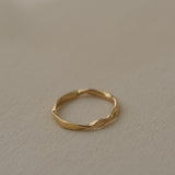RIVER ring handcrafted from 18k recycled gold, featuring a natural shiny surface, designed in Basel, Switzerland.