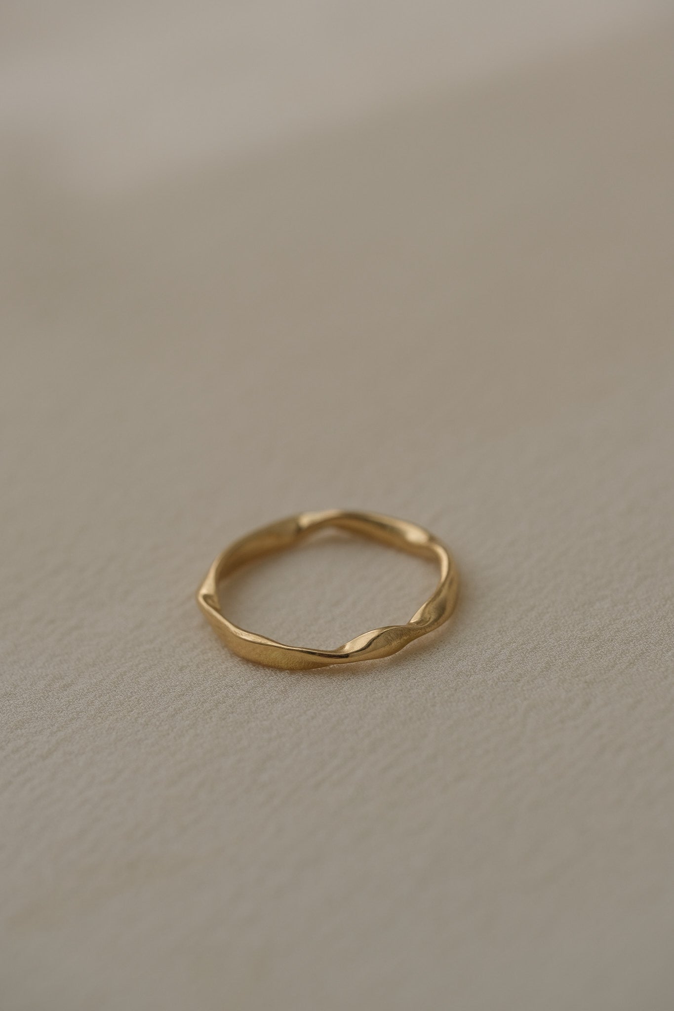 RIVER ring handcrafted from 18k recycled gold, featuring a natural shiny surface, designed in Basel, Switzerland.