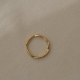 Handcrafted RIVER ring in 18k recycled gold from Basel, Switzerland, featuring a natural shiny surface.