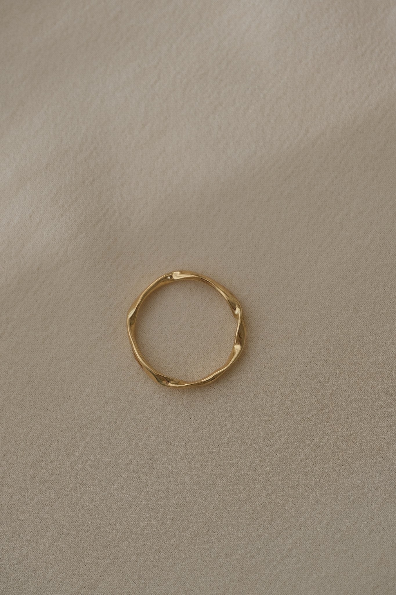 Handcrafted RIVER ring in 18k recycled gold from Basel, Switzerland, featuring a natural shiny surface.