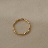 RIVER ring in 18k recycled gold, handcrafted in Basel, Switzerland, featuring a natural shiny surface.