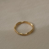 Handcrafted 18k recycled gold ring with a natural shiny surface, made in Basel, Switzerland.