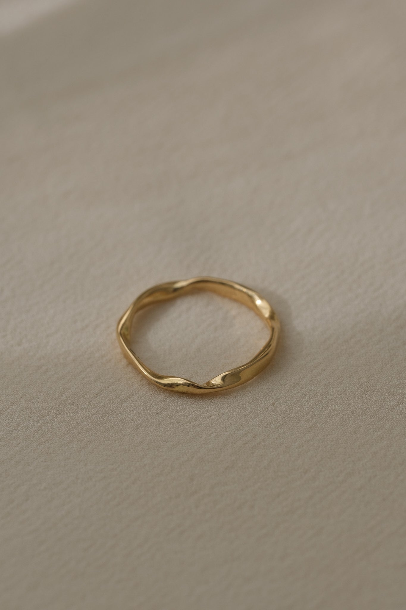 Handcrafted 18k recycled gold ring with a natural shiny surface, made in Basel, Switzerland.