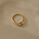 TWINE ring in 18k recycled gold, handcrafted in Basel Switzerland, featuring a natural shiny surface.