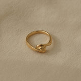 TWINE ring handcrafted in 18k recycled gold, featuring an organic design from Basel, Switzerland.