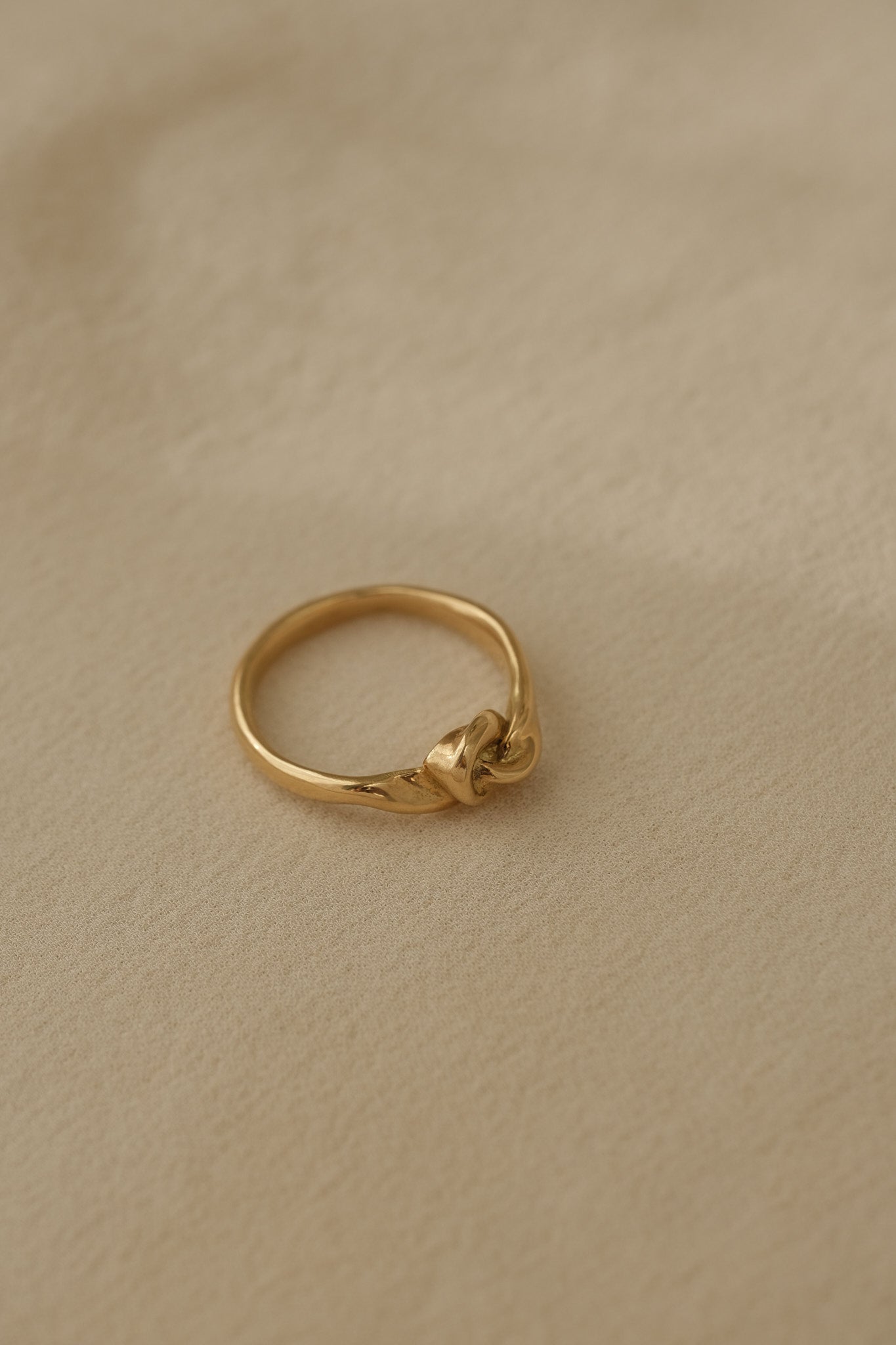 TWINE ring in 18k recycled gold, handcrafted in Basel, Switzerland with a natural shiny surface.