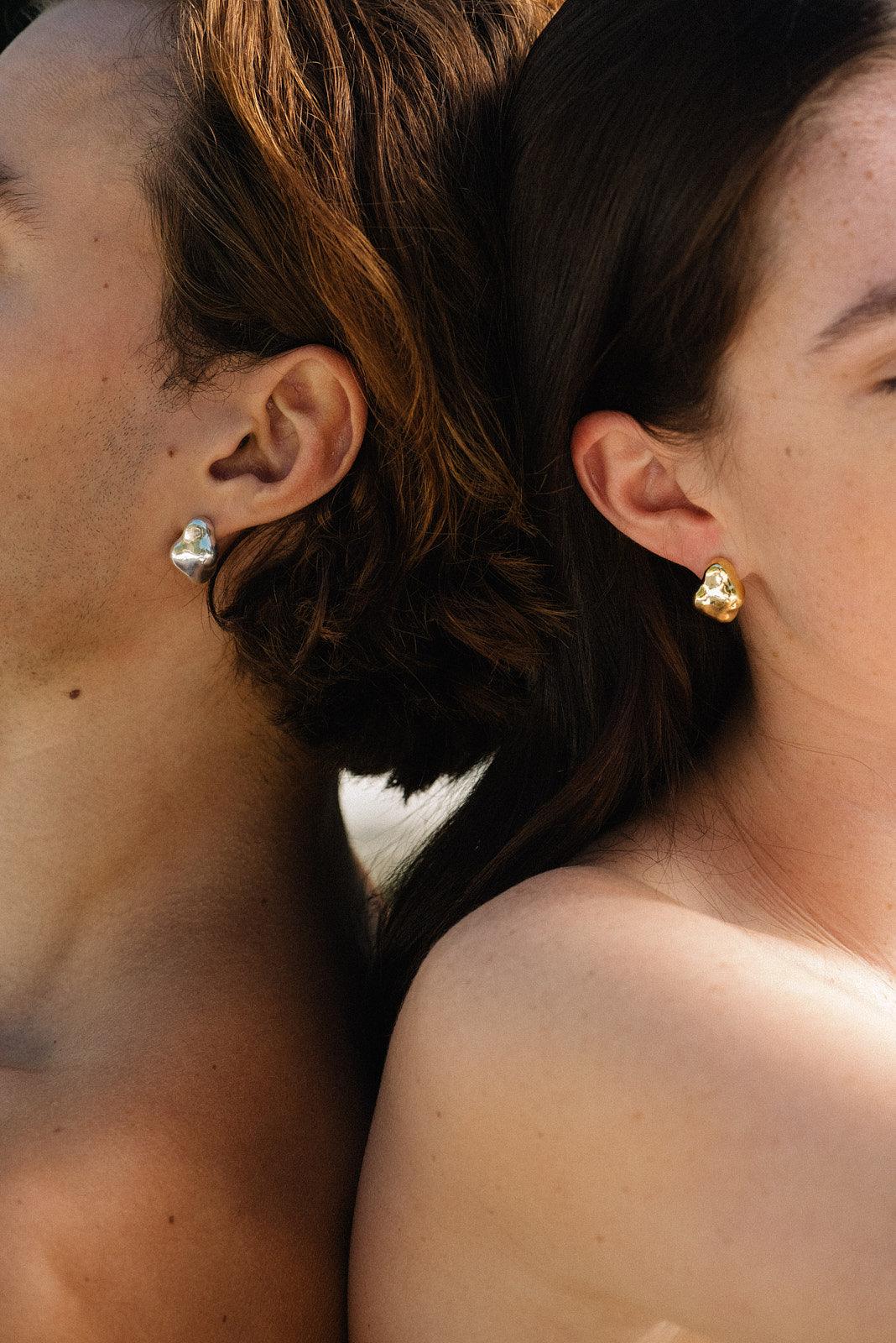 Ethically crafted CLOUD earrings in recycled silver, worn by two models, showcasing sustainable and handmade jewelry.