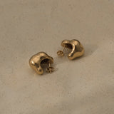 CLOUD earrings made of recycled gold with a natural shiny surface, designed in Basel, Switzerland, and ethically handcrafted.