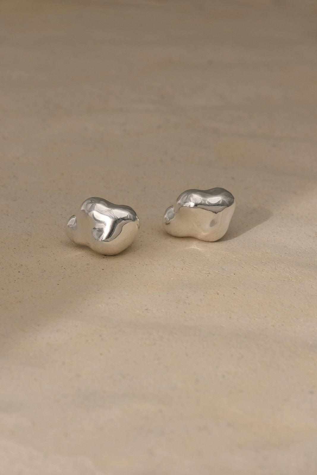 CLOUD earrings in recycled silver, showcasing ethical handmade jewelry with a natural shiny finish.