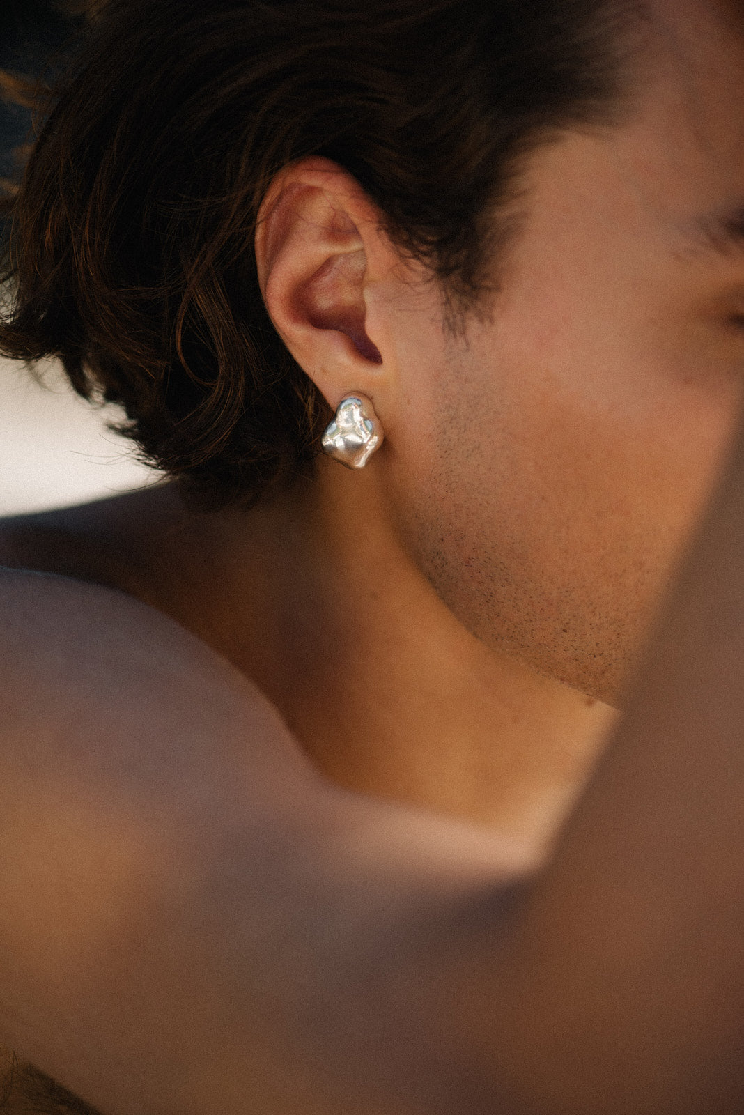 Handmade CLOUD earrings crafted from recycled silver, showcasing ethical jewelry with a sustainable design.