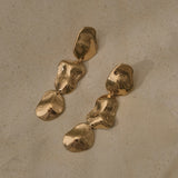 COSMA earrings in recycled gold, handmade ethical jewelry with a natural shiny surface, designed in Switzerland.