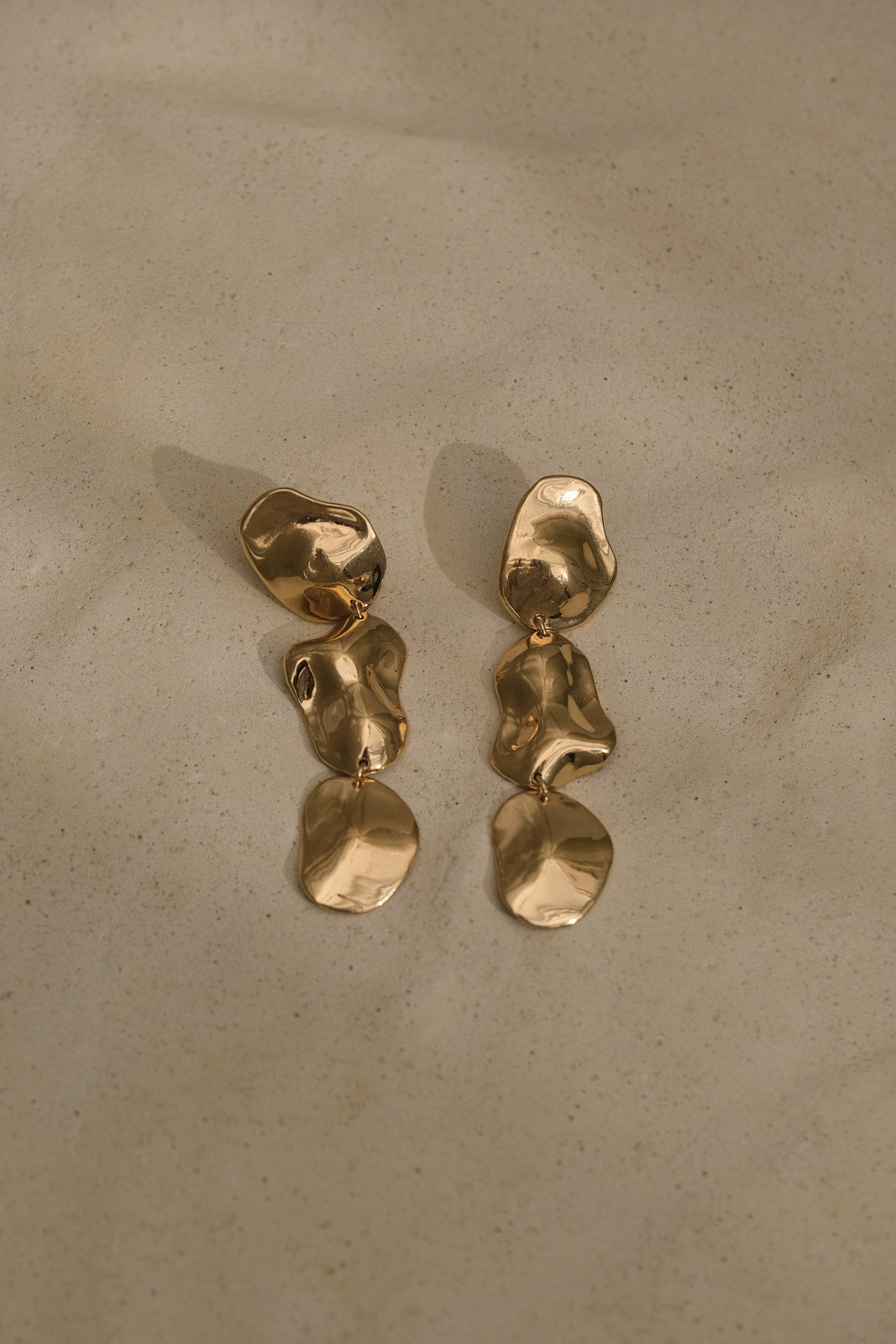 COSMA earrings in 18k gold-plated recycled silver, handmade, ethical jewelry, sustainable, with natural shiny surface.