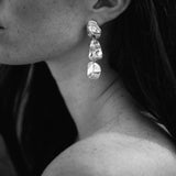 Elegant COSMA earrings made from recycled silver, showcasing ethical, handmade jewelry in a classic design.