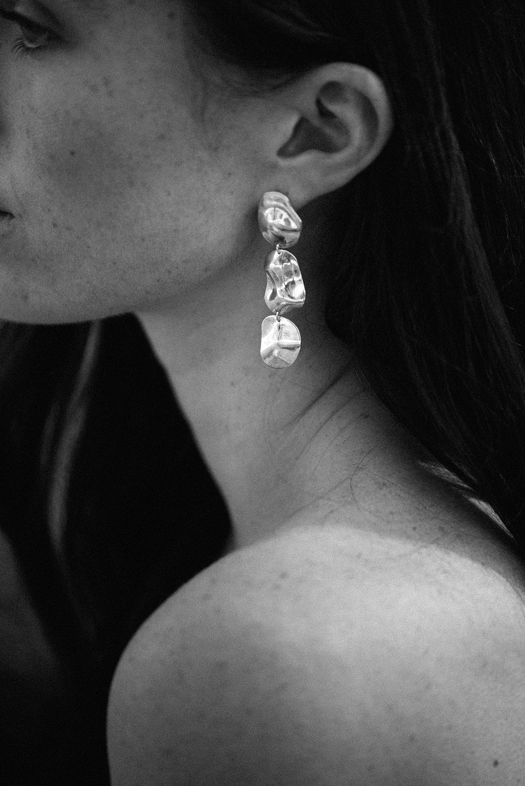 Elegant COSMA earrings made from recycled silver, showcasing ethical, handmade jewelry in a classic design.