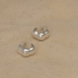 FLUID earrings made from recycled silver, showcasing sustainable and ethical handmade jewelry with a natural shiny finish.