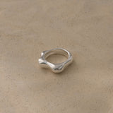 Handmade FLUID ring crafted from 925 recycled silver, embodying ethical jewelry and sustainable design.