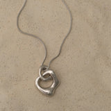 FUSE necklace crafted from 925 recycled silver, featuring a handmade pendant for sustainable, ethical jewelry.