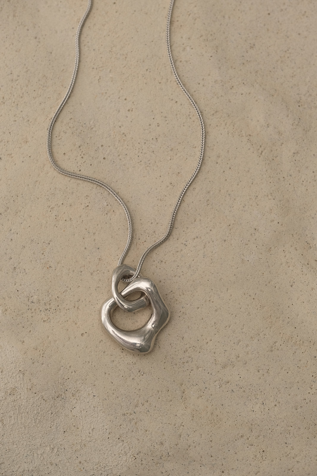 FUSE necklace crafted from 925 recycled silver, featuring a handmade pendant for sustainable, ethical jewelry.