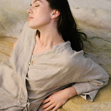 Model wearing FUSE necklace made of recycled gold and silver, showcasing ethical, sustainable handmade jewelry.