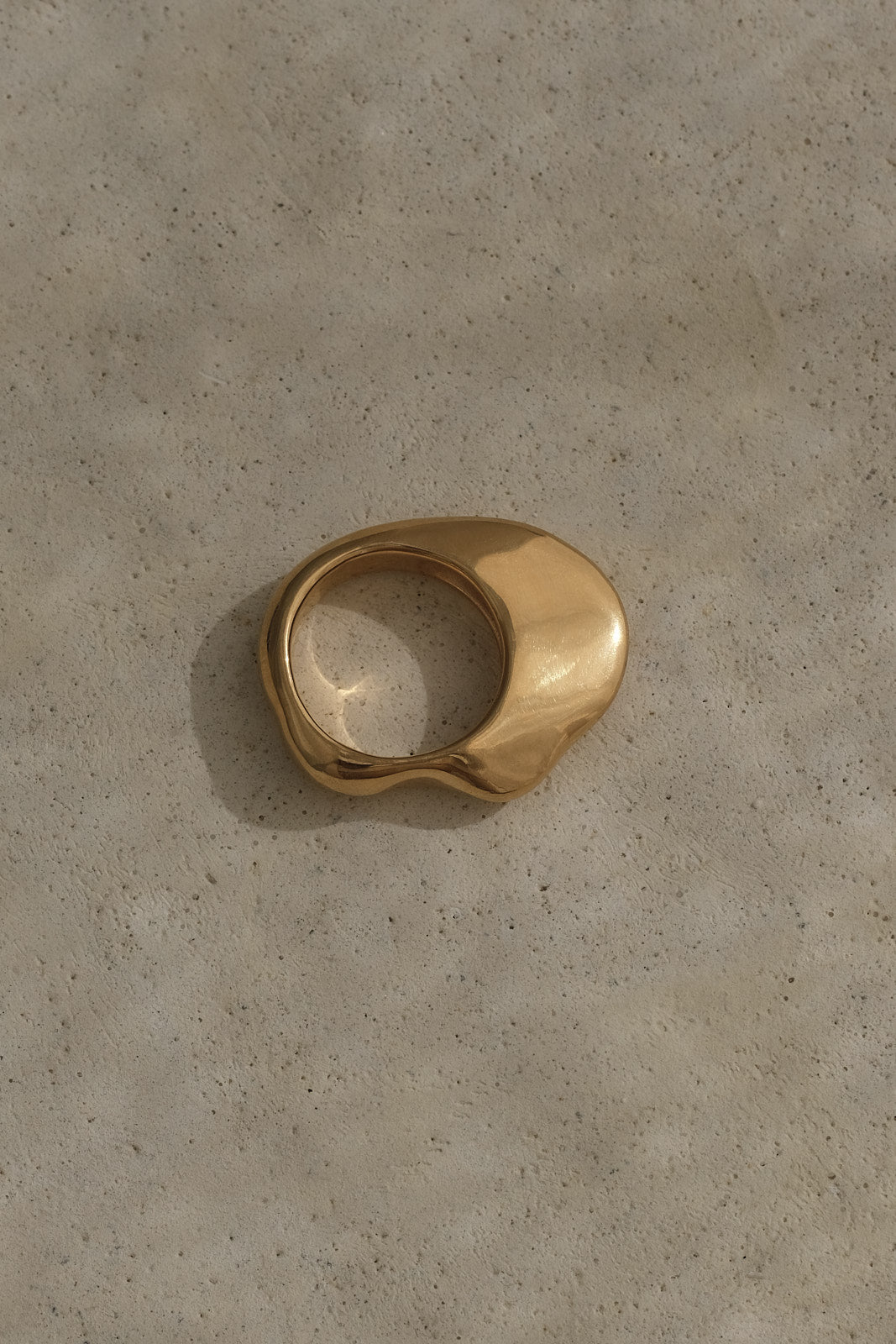 HALO ring in 18k gold plating on recycled silver, showcasing natural shiny surface and unique design.