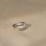 MISMO earcuff made of 925 recycled silver, showcasing ethical jewelry with a handmade, sustainable design.