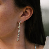 Handmade MURMUR earrings in recycled silver, showcasing ethical jewelry with a natural shiny finish.
