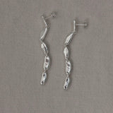 MURMUR earrings made of 925 recycled silver, showcasing an ethical and handmade design with a shiny surface.