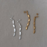 MURMUR earrings in recycled silver and gold-plated designs, showcasing sustainable and ethical handmade jewelry.