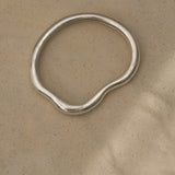 MUSA bangle made from sustainable 925 recycled silver, featuring a natural shiny surface and ethical design.