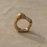 Handmade MUSA ring in 18k gold-plated recycled silver, showcasing a unique organic shape, ethical jewelry from Germany.