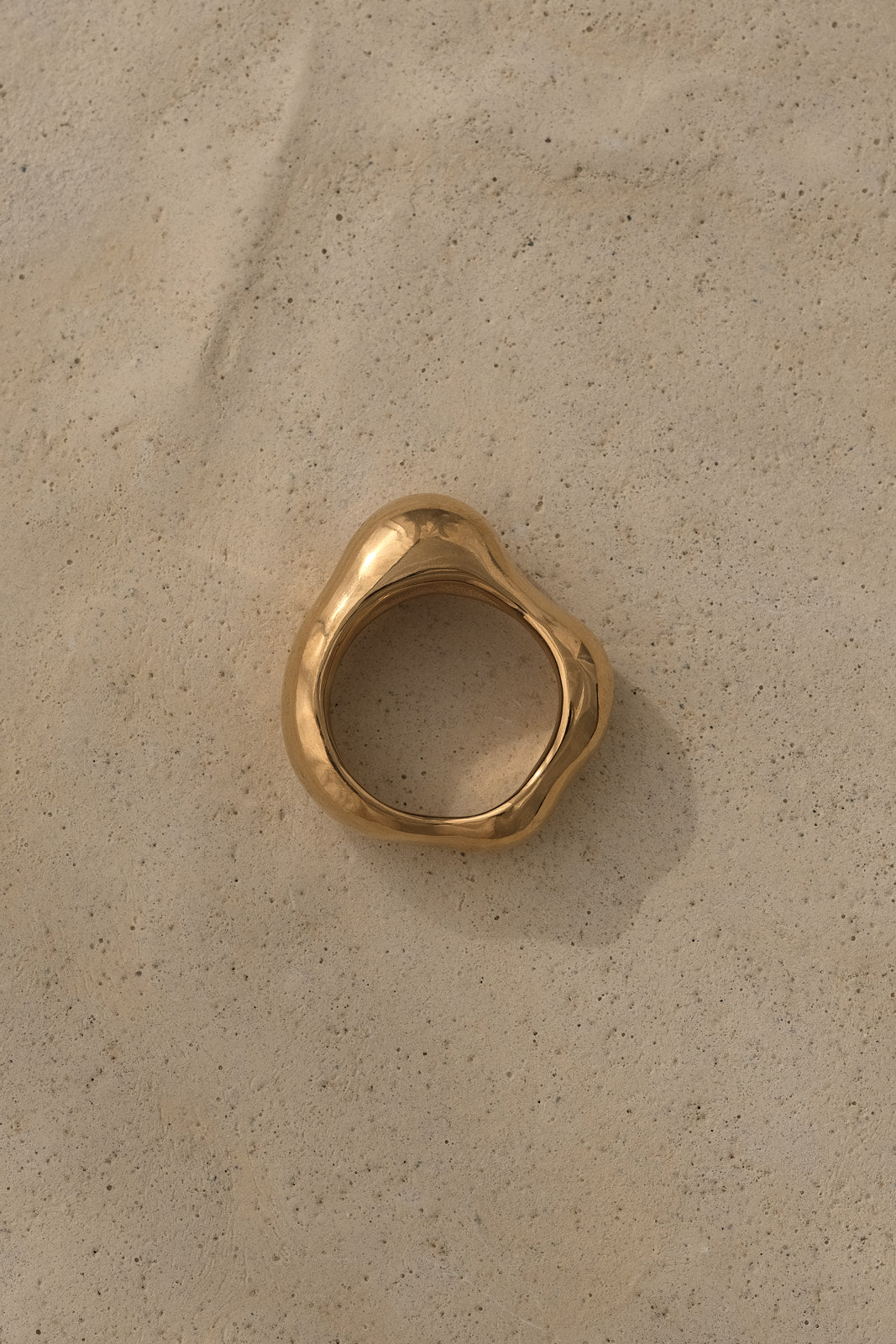 MUSA ring in gold finish made from recycled materials, representing ethical handmade jewelry.
